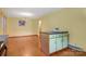 Bright dining room boasts hardwood floors and a center island with cabinets at 1405 8Th Nw Ave, Conover, NC 28613