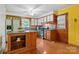 Bright kitchen features stainless appliances, an island, hardwood floors, and ample cabinet space at 1405 8Th Nw Ave, Conover, NC 28613
