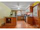 Bright kitchen with stainless appliances, an island, hardwood floors, and white cabinets at 1405 8Th Nw Ave, Conover, NC 28613