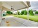Covered concrete patio overlooking a lush backyard at 1412 Afternoon Sun Rd, Matthews, NC 28104