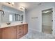 Bathroom featuring double vanity, walk-in shower, and view into walk-in closet at 1412 Afternoon Sun Rd, Matthews, NC 28104