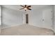 Bedroom with neutral walls, carpet, and a door for optimal privacy and convenience at 1412 Afternoon Sun Rd, Matthews, NC 28104