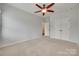 Bedroom with carpet, neutral walls, and closet with double doors for optimal storage at 1412 Afternoon Sun Rd, Matthews, NC 28104