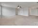 Large bedroom with carpet, neutral walls, and a door for easy access to other areas at 1412 Afternoon Sun Rd, Matthews, NC 28104
