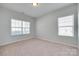 Neutral bedroom with large windows providing lots of natural light at 1412 Afternoon Sun Rd, Matthews, NC 28104