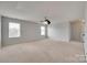 Expansive bedroom with a ceiling fan and carpeted flooring, offering plenty of room to enjoy at 1412 Afternoon Sun Rd, Matthews, NC 28104