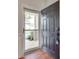 Elegant entry with a security door and dark wooden door opening to the foyer at 1412 Afternoon Sun Rd, Matthews, NC 28104