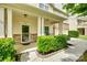 Inviting covered front porch with classic columns and a welcoming entrance at 1412 Afternoon Sun Rd, Matthews, NC 28104