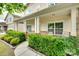 Charming front porch featuring decorative brick accents and neatly trimmed landscaping at 1412 Afternoon Sun Rd, Matthews, NC 28104