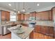 Kitchen featuring granite countertops, an island, stainless steel appliances, and hardwood floors at 1412 Afternoon Sun Rd, Matthews, NC 28104