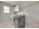 Laundry room featuring side-by-side washer and dryer at 1412 Afternoon Sun Rd, Matthews, NC 28104
