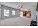 Open-concept living room featuring a fireplace and a view of the modern kitchen at 1412 Afternoon Sun Rd, Matthews, NC 28104