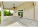 Covered concrete patio with ceiling fan and sliding door at 1412 Afternoon Sun Rd, Matthews, NC 28104