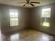 A bright bedroom with two windows and patterned floors at 1418 Old Wilkesboro Rd, Salisbury, NC 28144