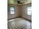 A simple bedroom with two windows and patterned floors at 1418 Old Wilkesboro Rd, Salisbury, NC 28144