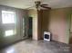 Cozy living room with neutral tones and ceiling fan at 1418 Old Wilkesboro Rd, Salisbury, NC 28144