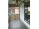 Cozy screened-in porch with ceiling fan, offering a relaxing outdoor space at 1418 Old Wilkesboro Rd, Salisbury, NC 28144