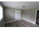 Comfortable bedroom with modern floors and window at 1421 Thompson Ave, Charlotte, NC 28216