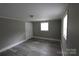 Spacious bedroom with modern floors and neutral paint at 1421 Thompson Ave, Charlotte, NC 28216