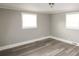 Bedroom featuring two windows and neutral paint at 1421 Thompson Ave, Charlotte, NC 28216