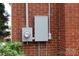 Outdoor electrical box mounted on brick exterior of house at 1421 Thompson Ave, Charlotte, NC 28216