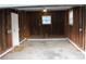 Unfinished garage interior with brick foundation and window to exterior at 1421 Thompson Ave, Charlotte, NC 28216