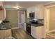 Beautiful kitchen featuring granite countertops, stainless steel appliances, and refinished cabinets at 1421 Thompson Ave, Charlotte, NC 28216