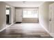 Open-concept living room showcasing wood-look flooring at 1421 Thompson Ave, Charlotte, NC 28216