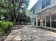Inviting backyard with a stone patio perfect for entertaining or relaxing at 14211 Harlequin Dr, Charlotte, NC 28273