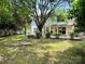 Spacious backyard view with a stone patio and a white two-story home at 14211 Harlequin Dr, Charlotte, NC 28273