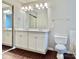 Bathroom featuring a double vanity and a large mirror at 14211 Harlequin Dr, Charlotte, NC 28273