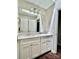 Bathroom featuring a double vanity with modern hardware and fixtures at 14211 Harlequin Dr, Charlotte, NC 28273