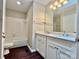 Bathroom featuring a double vanity, bathtub and white tile at 14211 Harlequin Dr, Charlotte, NC 28273