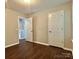 Bedroom with hardwood floors and white doors at 14211 Harlequin Dr, Charlotte, NC 28273