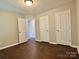 Bedroom with hardwood floors and white doors at 14211 Harlequin Dr, Charlotte, NC 28273