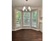 Charming dining area with a bay window offering plenty of natural light and backyard views at 14211 Harlequin Dr, Charlotte, NC 28273