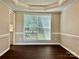 Dining room with great window view and gorgeous trim work at 14211 Harlequin Dr, Charlotte, NC 28273