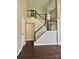 Spacious foyer with a beautiful staircase and dark wood floors at 14211 Harlequin Dr, Charlotte, NC 28273
