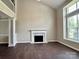 Bright living room with a fireplace and beautiful hardwood floors at 14211 Harlequin Dr, Charlotte, NC 28273