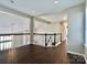 Open loft area showcasing a view of the lower level and connecting hallways with stairs at 14211 Harlequin Dr, Charlotte, NC 28273