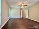 Main bedroom with ceiling fan and hardwood floors at 14211 Harlequin Dr, Charlotte, NC 28273