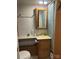 Standard bathroom featuring a medicine cabinet, floral shower curtain, and a yellow sink at 146 Larboard Trl, Mount Gilead, NC 27306