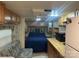 Cozy bedroom featuring a comfortable bed, ample storage, and integrated kitchen area at 146 Larboard Trl, Mount Gilead, NC 27306