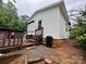 Exterior angled view of a white home showing a wooden deck, trash can, and camper at 146 Larboard Trl, Mount Gilead, NC 27306