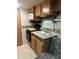 Compact kitchen featuring wood cabinets, modern appliances, and a functional layout at 146 Larboard Trl, Mount Gilead, NC 27306