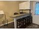 A charming kitchenette features stylish seating, complemented by ample cabinet space and modern finishes at 146 Larboard Trl, Mount Gilead, NC 27306