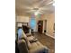 Inviting living room featuring a cozy couch, a kitchenette, and wood-look floors at 146 Larboard Trl, Mount Gilead, NC 27306