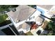A back aerial perspective showing a white home featuring a deck, patio, and well-manicured backyard at 14615 Bridle Trace Ln, Pineville, NC 28134