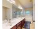 Bathroom with a double vanity, large mirror, soaking tub, and glass shower at 14615 Bridle Trace Ln, Pineville, NC 28134