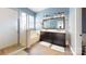 Bathroom featuring a double vanity, shower, and soaking tub at 14615 Bridle Trace Ln, Pineville, NC 28134